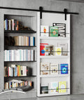 Sliding Barn Door With Shelf Style 48x84 Inches Primed MDF Includes 8ft Hardware Kit For Easy Mount Farmhouse Look You Can Paint DIY Ready Assembly Required with books displayed in a modern home setting.