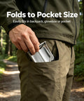 Person placing Ultra Portable Folding Shovel For Camping And Garden Tasks Mini Trowel into pocket