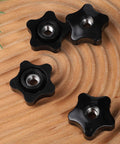 Heavy Duty Black Star Knobs Set, 3/8-16 Wing Nuts with Female Thread, 4 Pack Clamp Knobs for T Track Bolts, on wooden surface.