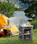 Folding Grill Table With 26 Inch Tabletop And Detachable Windscreen for camping kitchen next to a tent, outdoor setting.