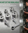 No Sweat Heavy Duty Ratchet Knockout Hole Punch Driver Kit with six precision dies set on metal table.