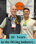 Two people at a diving industry exhibit wearing Octopus Regulator Necklace For Scuba Gear Made With Medical Grade Silicone.