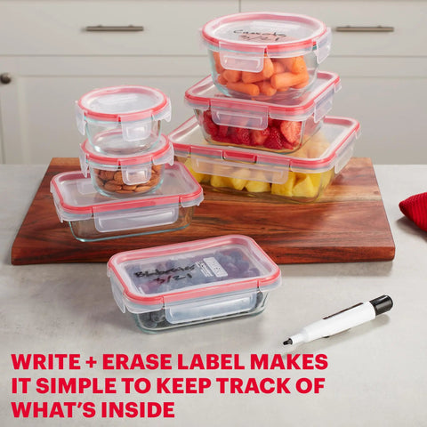 Freshlock 14 Piece Glass Food Storage Containers Set with airtight lids, various sizes on a kitchen counter, labeled for convenience.