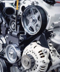 Serpentine Belt 6PK2225 OEM Quality With Run Quiet Technology for Cadillac engine installed, showing pulleys and tensioner