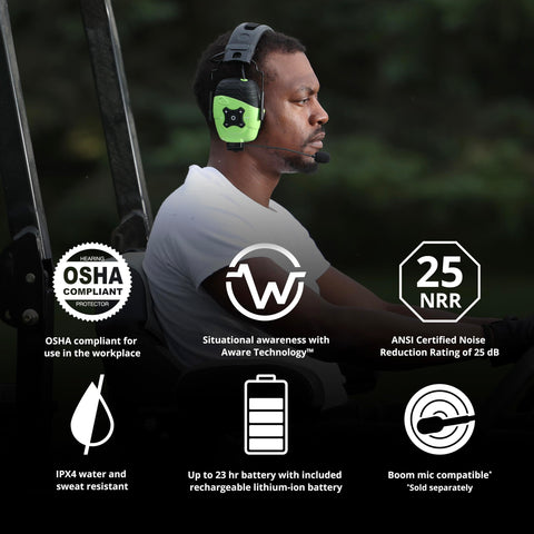Man wearing Bluetooth Hearing Protection Earmuffs With Aware Technology on lawn mower, safety green, showcasing features.