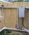 Portable Propane Tankless Water Heater With 41000 BTU And 1.58 GPM Digital Display CSA Certified installed in outdoor bamboo shower