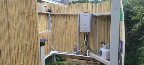 Portable Propane Tankless Water Heater With 41000 BTU And 1.58 GPM Digital Display CSA Certified installed in outdoor bamboo shower