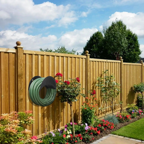 Heavy Duty Wall Mount Garden Hose Holder With High Carbon Steel Construction Outdoor No Fuss Hose Hanger Rack For Up To 125 Feet Of Hose Rust Proof Durable Water Hose Storage Organizer For Yard And Patio on wooden fence.