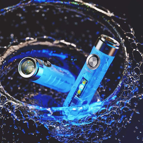Aurora A7 G4 Keychain Flashlight USB C Rechargeable 650 Lumen EDC Light With 8 Modes glowing blue under water for emergencies