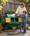 Woman and child using a 43 Gallon Dual Chamber Compost Tumbler With Gloves, Fast Assembly And Easy Setup For Outdoor Use in a garden