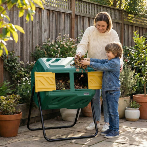Woman and child using a 43 Gallon Dual Chamber Compost Tumbler With Gloves, Fast Assembly And Easy Setup For Outdoor Use in a garden