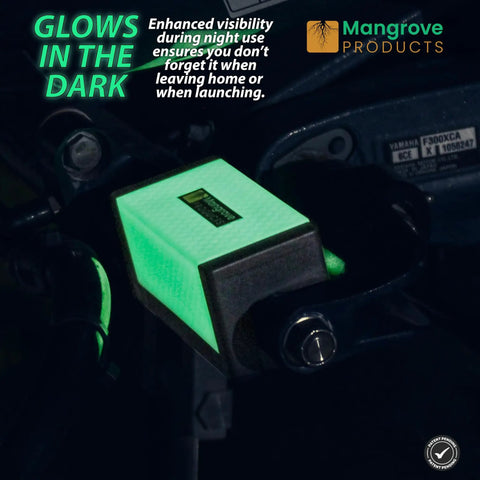 Glowing green 4 Inch Hydraulic Outboard Steering Lock for trailering and boating attached to boat motor.