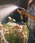 Swivel Garden Hose Adapter Protector With All Metal Construction And Three Quarter Inch Connection Extends Your Hose For Flexible Angles Prevents Kinks And Leaks For No Fuss Watering Reach And Durable Hose Extension, brass hose extender in use