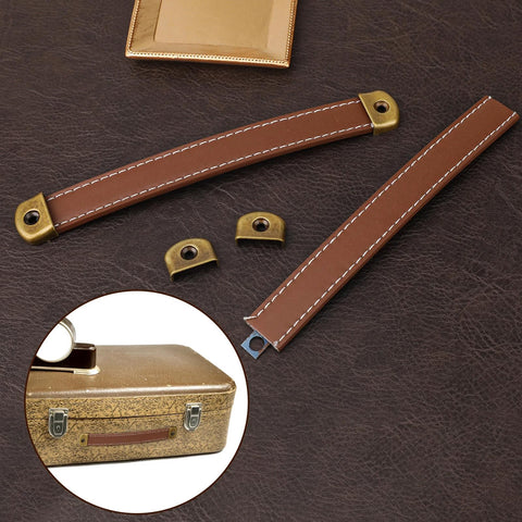 Leather Drawer Pulls Set Of 2 With Mounting Screws Brown PU Leather Trunk Handles And Cabinet Pulls displayed against leather surface