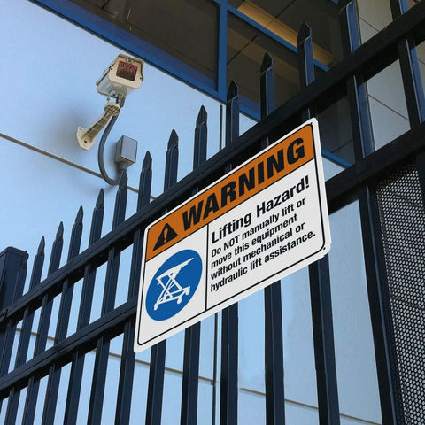 Heads Up Lifting Hazard Do Not Manually Lift Or Move This Equipment 8x12 Inch Construction Safety Warning Sign on a fence