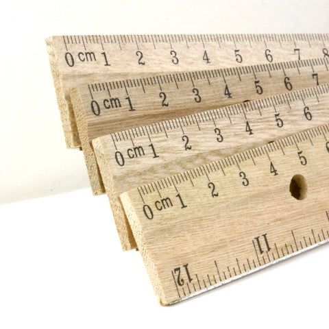 Close-up of 12 Inch Wooden Ruler With Inch And Metric Measurements Dual Scale For School Office Or Home Use