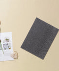 Pearl Cotton Foam Sheets 2 Pack Ultra Tear Resistant Soft Cushioned Pads next to a tulip and magazine on beige surface
