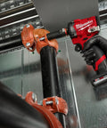 M12 Fueltrade Stubby 1/2-Inch Impact Wrench Tool Only being used on pipe fitting, displaying its compact size and power