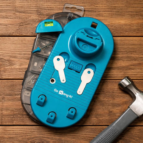 All In One Picture Hanging Kit With Level Tool And Sawtooth And Wire Hangers, Wall Mount Kit in case on wooden surface