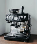 Breville espresso machine with 54mm Bottomless Naked Portafilter For Breville Barista Express And Barista Pro on countertop
