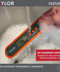 Waterproof Digital Meat Thermometer With Folding Probe And Backlit Display In Orange submerged in water, showcasing waterproof feature