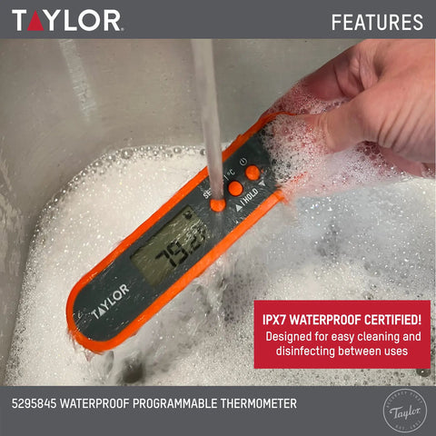 Waterproof Digital Meat Thermometer With Folding Probe And Backlit Display In Orange submerged in water, showcasing waterproof feature