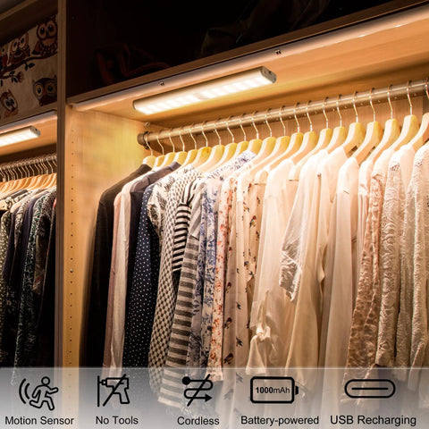 Super Bright Rechargeable Closet Lights With 78 LED Motion Sensor Night Lighting illuminating clothes on a hanger in a wardrobe.