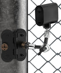 Heavy Duty Magnetic Fence Mount For Action Cameras And Phones With Dual Quarter Inch Mount Points Built For Game Day Recording On Baseball And Tennis Fields Quick Setup For Mevo Start GoPro iPhone And Other Cameras installed on a fence with a camera attached.
