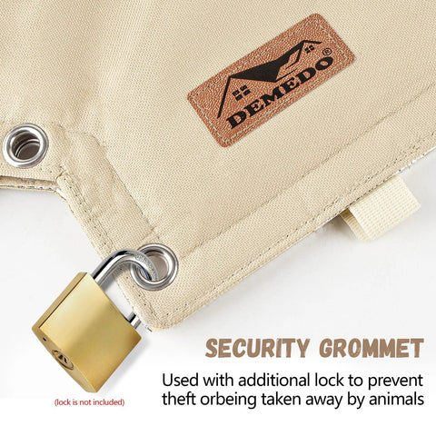 Backflow preventer cover in beige canvas with metal grommets and an attached brass padlock