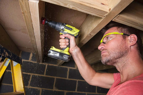 High Output 18V Cordless Drill Driver With 22 Torque Settings And Self Tightening Chuck, Includes 2.0Ah And 4.0Ah Lithium Batteries, Fast Charger, And Rugged Carrying Case For Serious DIY Wins And Garage Grinds in use on wood.