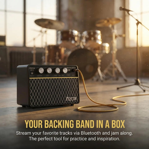 10W Wireless Portable Guitar Amp With Type C Rechargeable Battery in music studio, drums and microphone blurred in background.