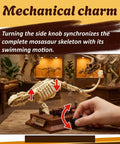 Hand turning knob on Mosasaurus Fossil Building Block Set With Gear Driven Skeleton And Dope Display Base For Collectors And Dino Fans Includes Display Stand And Museum Quality Fossil Detailing.