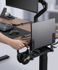 Adjustable Under Desk Laptop Holder With Integrated Cord Organizer Rack Quick Grip Edge Clamp holding a laptop and headphones