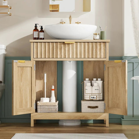Kick Up Your Bathroom Style With This Slick Fluted Pedestal Sink Cabinet Featuring Two Doors And A Bottom Drawer In Natural Oak U Shape Cutout For Dope Space Saving Vibes with storage inside.