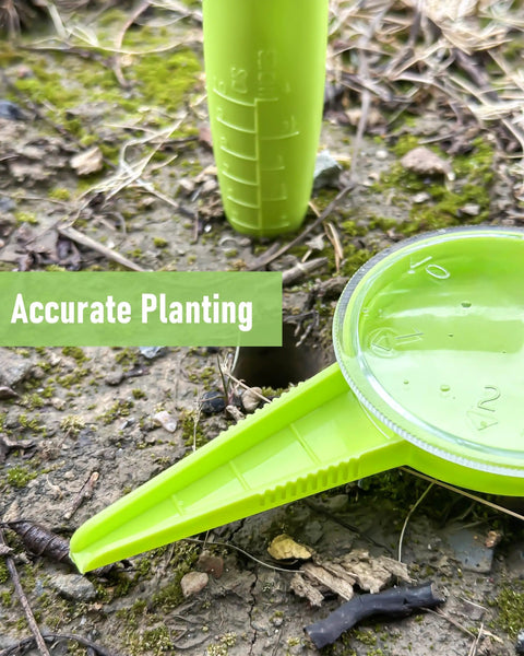 Close-up of Go-To Handheld Seed Spreader And Planter Tool With Dibber for small seeds on soil, light green in color.