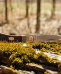 Bearhead Lockback Pocket Knife With A 2.2 Inch High Carbon Stainless Steel Blade on mossy log in a forest