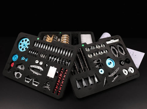 Hands On V8 Engine Model Kit That Actually Runs parts layout, metal components, educational STEM project kit with instructions visible.