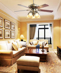 52 Inch Indoor Ceiling Fan With LED Light And Remote Control In New Bronze Finish above a living room with sofas and wall art