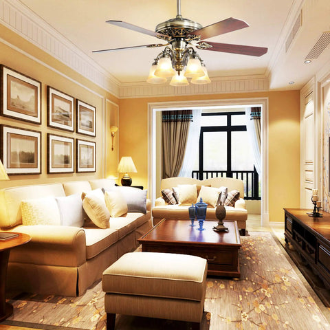 52 Inch Indoor Ceiling Fan With LED Light And Remote Control In New Bronze Finish above a living room with sofas and wall art