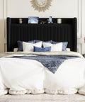 Queen Size Velvet Bed Frame With Storage Headboard And Charging Station Black Upholstered Bookshelf Base with navy bedding and device chargers.