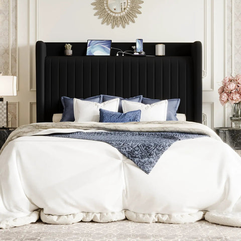 Queen Size Velvet Bed Frame With Storage Headboard And Charging Station Black Upholstered Bookshelf Base with navy bedding and device chargers.