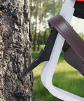 Close-up of Aluminum Tree Climbing Spikes 1 Pair With Straps And Spike Protectors 350 Pound Load Capacity Arborist Gear in use on tree