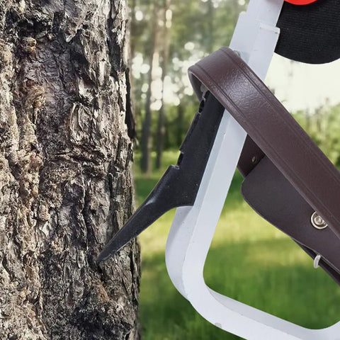 Close-up of Aluminum Tree Climbing Spikes 1 Pair With Straps And Spike Protectors 350 Pound Load Capacity Arborist Gear in use on tree