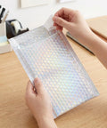 Glitter Bubble Mailers 30 Pack Tear Resistant Shipping Bags for Jewelry Makeup Gifts shown in use