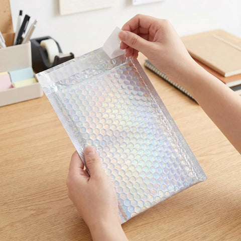 Glitter Bubble Mailers 30 Pack Tear Resistant Shipping Bags for Jewelry Makeup Gifts shown in use