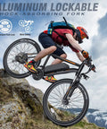 Rider on All Terrain Electric Mountain Bike For Adults With 26 Inch Wheels 350W Motor cruising on rugged mountain trail.