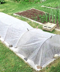 Two Pack 10 By 33 Feet Backyard Garden Netting Ultra Fine Mesh That Keeps Birds And Bugs Out While Shielding Vegetables And Fruits Raised Bed Plant Covers For Outdoor Garden Protection installed over garden bed.