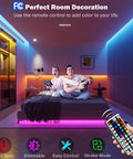 Leeleberd RGB LED strip lights, 100 ft (2x50 ft), installed under bed and along wall in a modern bedroom with remote.
