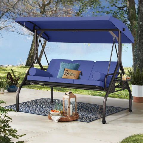 Three In One Outdoor Porch Swing Bed With Canopy Three Seat Patio Glider in dark blue set up on a porch with cushions.