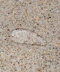 Water bead on concrete surface treated with Deep Penetrating Concrete Sealer Silane Siloxane Formula Locks Out Moisture For Driveways And Patios Keeps Surfaces Bone Dry Without Shine Repels Grime And Delivers Solid Slab Armor For Heavy Traffic One Gallon.